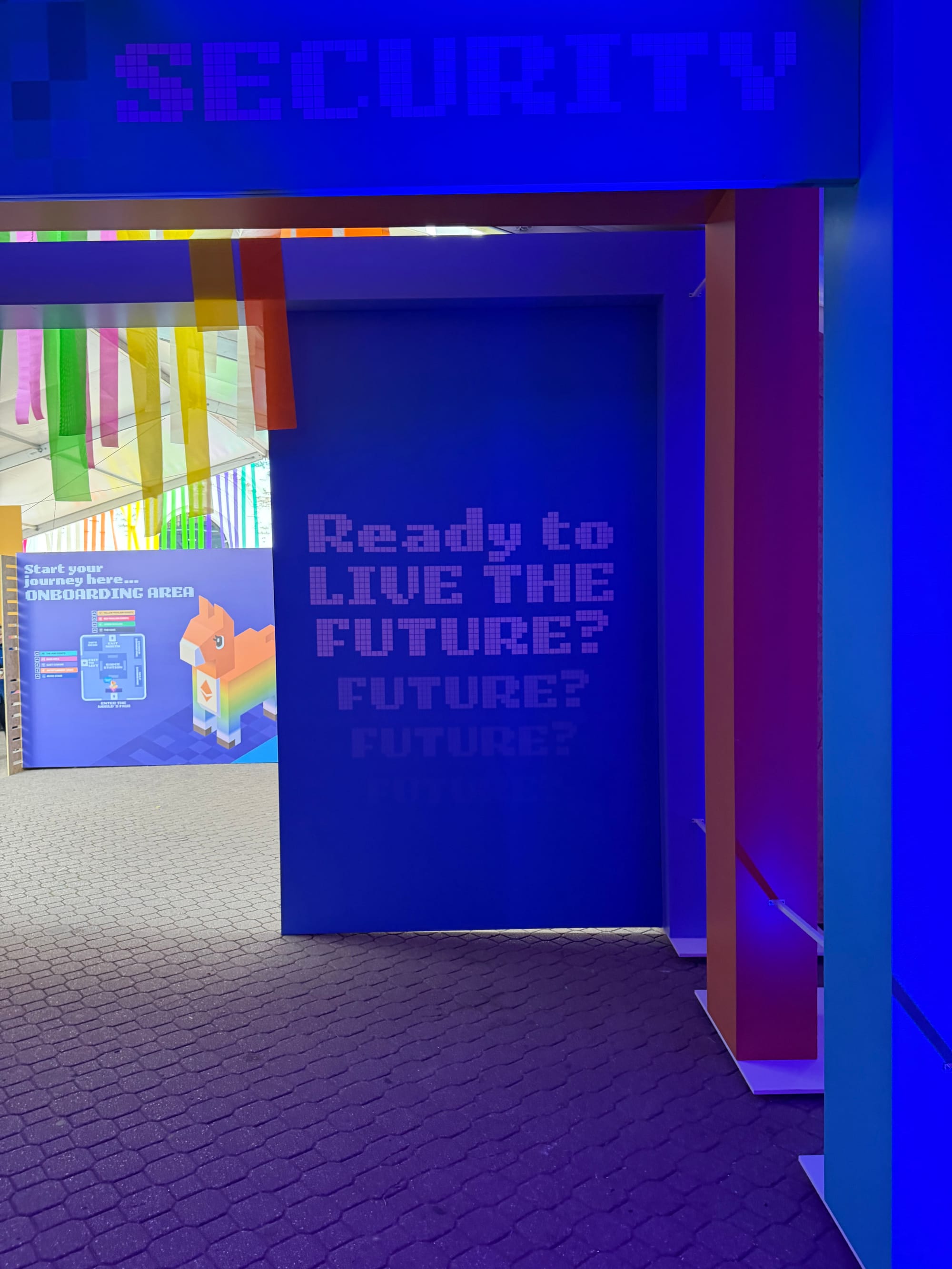 Devconnect conference entrance featuring 'Ready to Live the Future?' signage and onboarding area at Ethereum World's Fair Buenos Aires