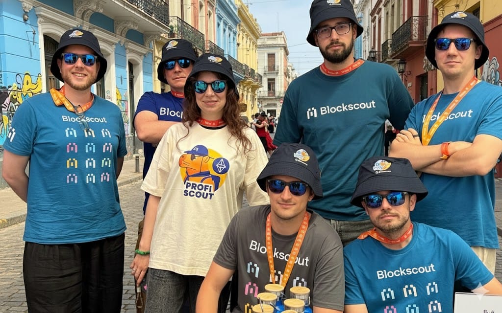 Blockscout team at blockchain conference wearing branded t-shirts and Profiscout hats on colorful colonial street