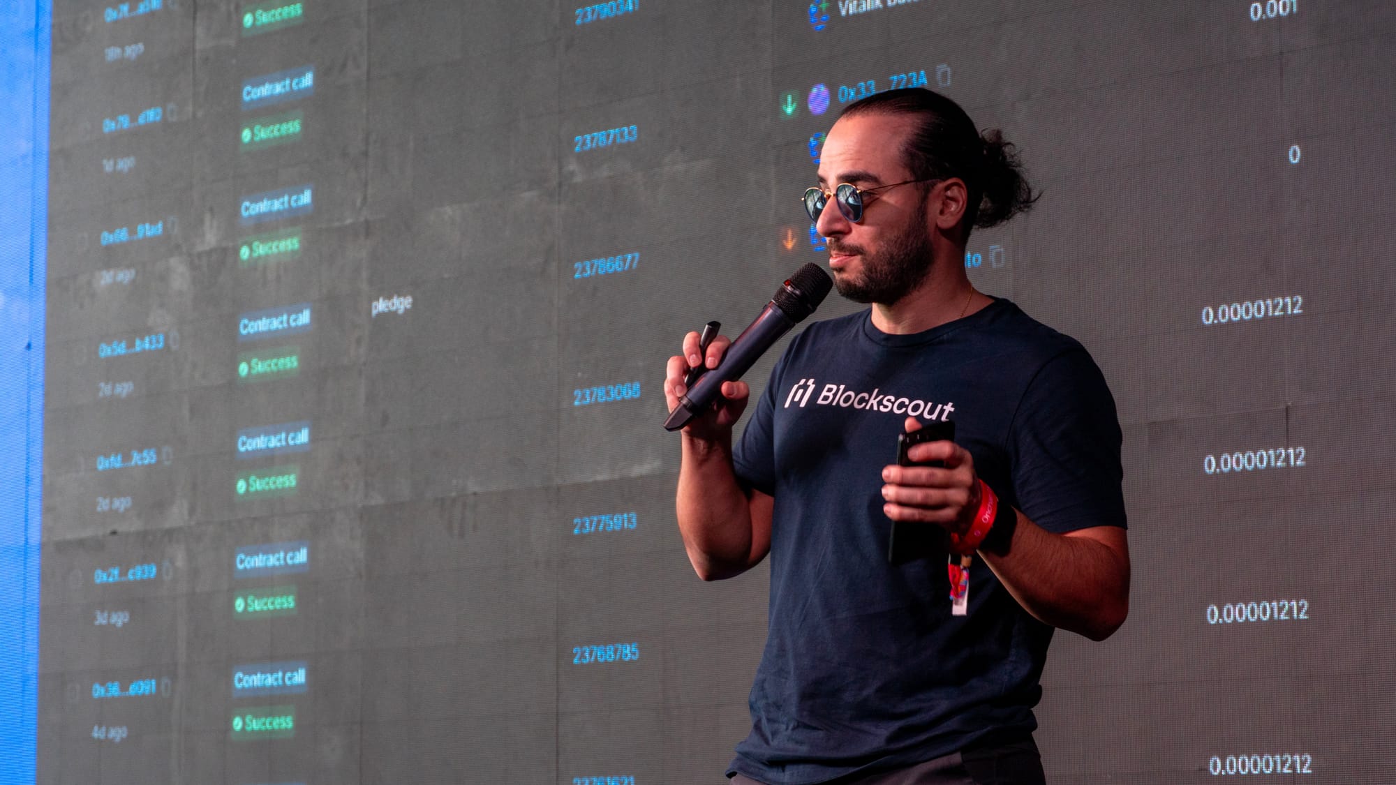 Blockscout speaking at DevConnect Buenos Aires with the Blockscout explorer dashboard in the background